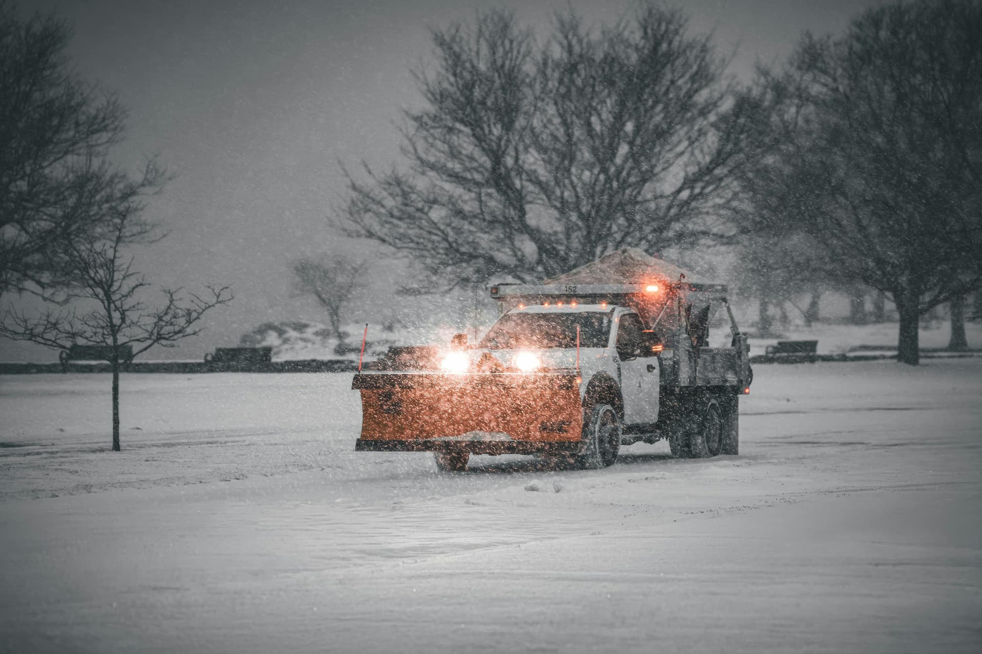 UK road gritting truck spreading salt on winter highway